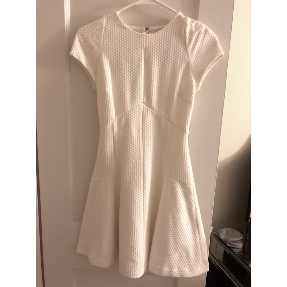 Very flattering & stretchy white cap sleeve dress